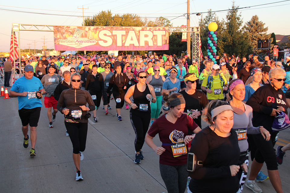 Runners and walkers take off at the Community First Fox Cities Marathon.