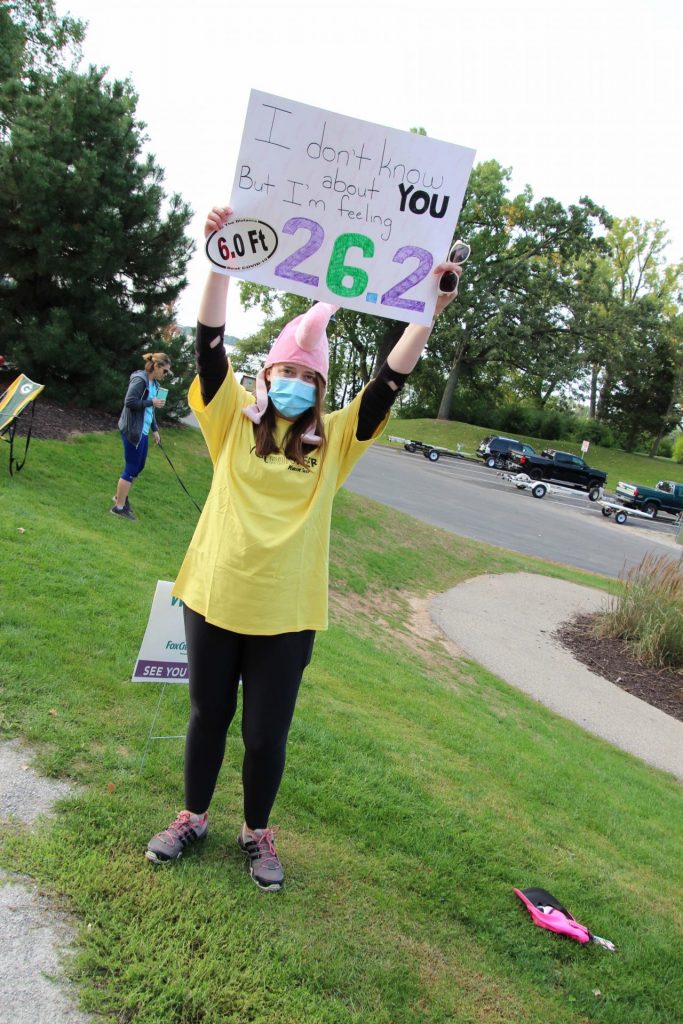 Pop-up Cheer Volunteers encourage runners and walker at Fritse Park in Fox Crossing.