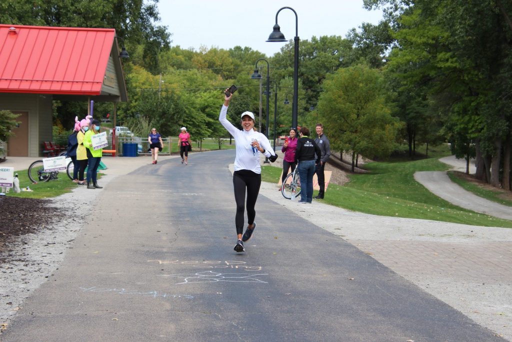 Pop-up Cheer Volunteers encourage runners and walker at Fritse Park in Fox Crossing.