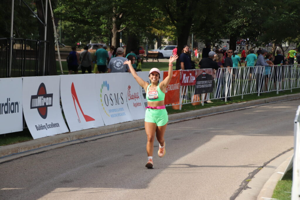 Woman running 10K in Fox Cities Marathon.