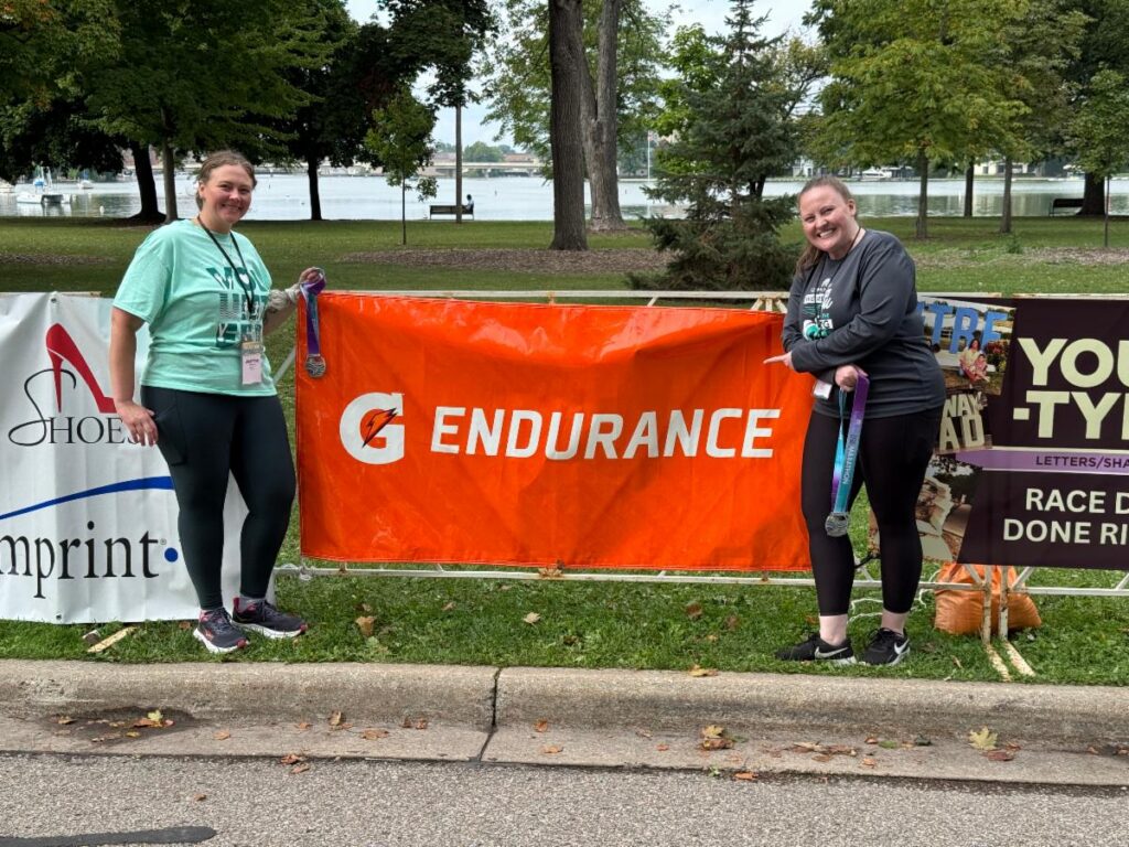 Fox Cities Marathon Gatorade Endurance banner with volunteers.