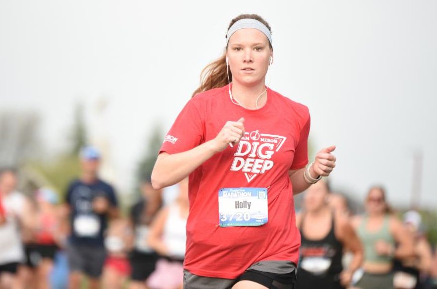 Fox Cities Marathon Course Connection March 2026 woman runner from Miron Construction.