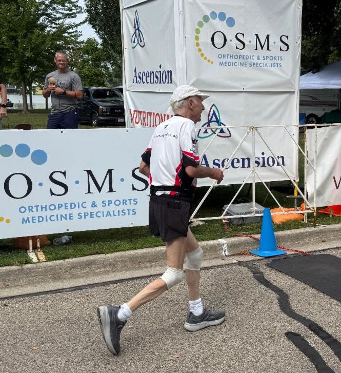 Fox Cities Marathon runner in white shirt.