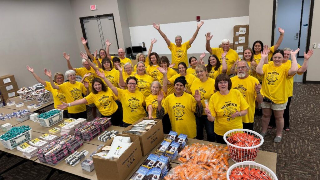 Fox Cities Marathon Volunteer Team filling goodie bags.