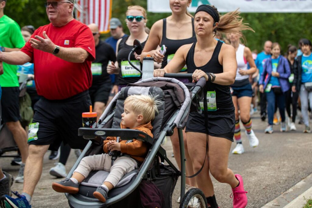 Fox Cities Marathon woman running with stroller.