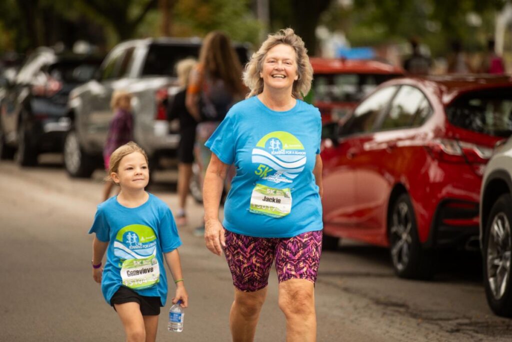Fox Cities Marathon woman and child running.